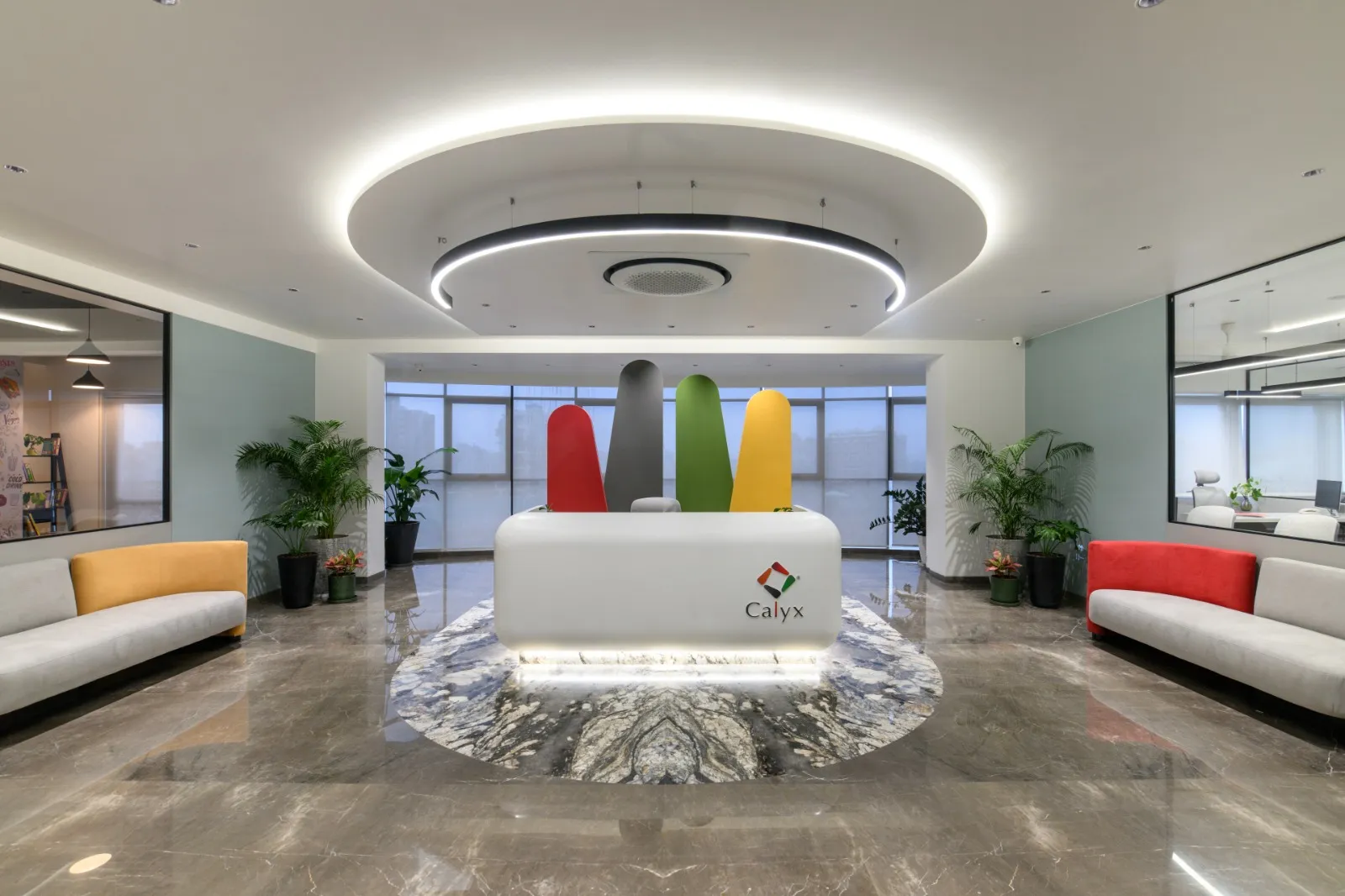 Reception at the Calyx office, with sculptures in the four colours of the Calyx mark.